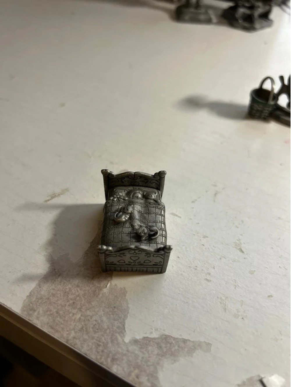 Pewter cat bed with earrings